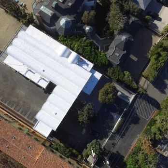 Aerial view of an estate re-roof by Ocean Seven Builders