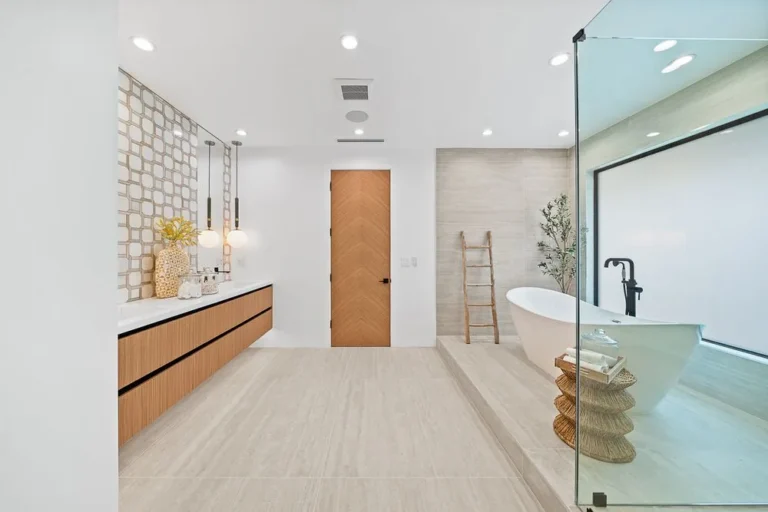 Spa-style primary bathroom with freestanding tub and walk-in shower